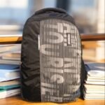 American Tourister vertical stripe pattern Backpack, the perfect fusion of bold design and uncompromising functionality built for the modern student and commuter
